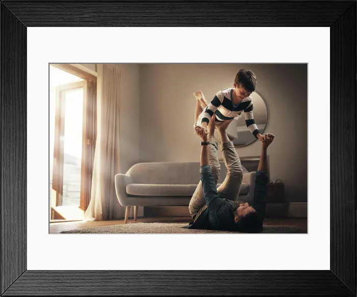 Framed Print : Funny, dad and lift kid for game Framed Print : Funny, dad and lift kid for game