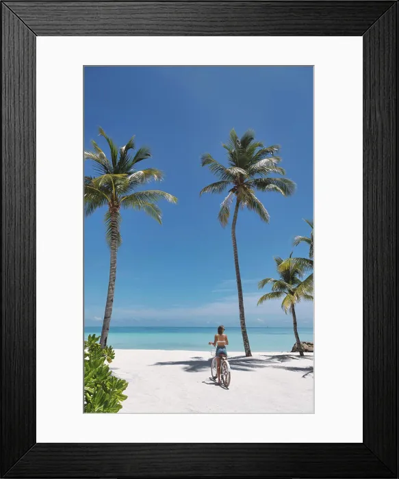 Framed Print : Woman riding bicycle on the beach Framed Print : Woman riding bicycle on the beach