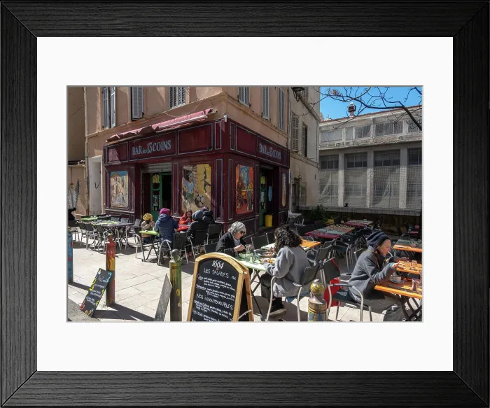 Framed Print : Marseille, France March 14, 2025 People sitting at an outdoor cafe in the Le Panier district Framed Print : Marseille, France March 14, 2025 People sitting at an outdoor cafe in the Le Panier district