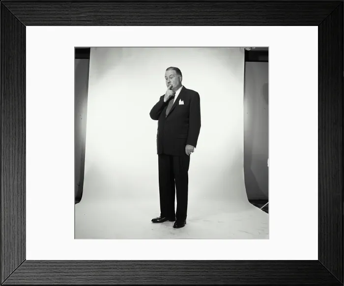 Framed Print : Senior businessman thinking with hand on chin Framed Print : Senior businessman thinking with hand on chin