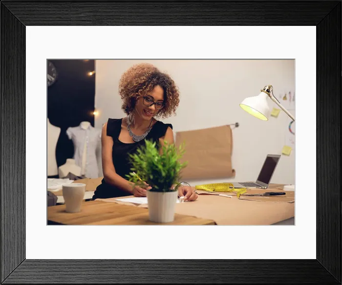 Framed Print : Fashion designer on her Atelier