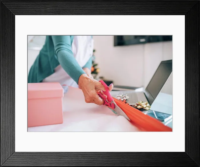 Framed Print : Woman wrapping Christmas gifts Framed Print : Woman wrapping Christmas gifts