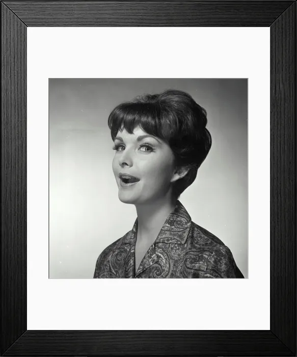 Framed Print : Vintage Photograph. A woman with her mouth open facing to the left of frame looking at the camera