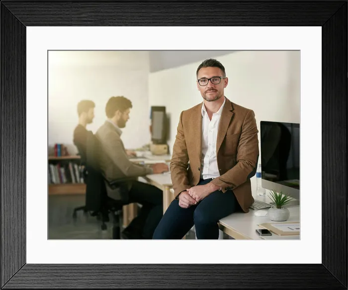 Framed Print : Creative, man and portrait or relax on table in office for work or career in project management by agency