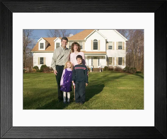 Framed Print : Family standing outside their house Framed Print : Family standing outside their house