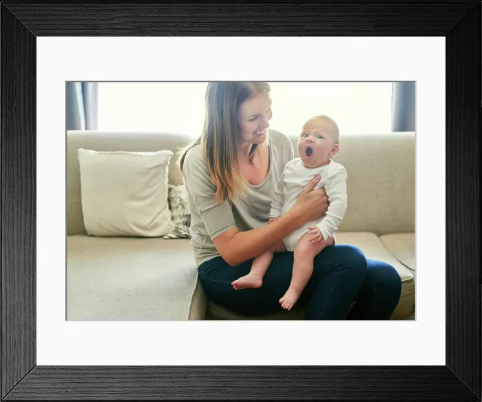Framed Print : Love, security or yawn with mother and baby on sofa in living room of home together for bonding
