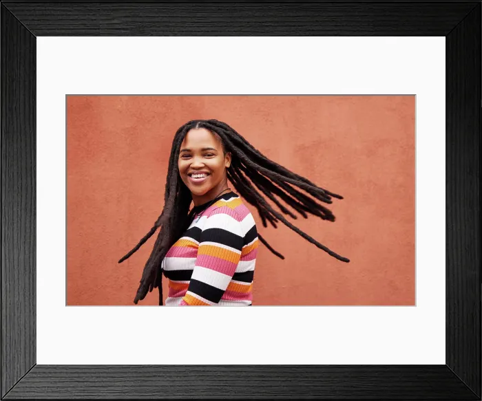Framed Print : Playful, fun and portrait of a black woman with a smile isolated on a studio background