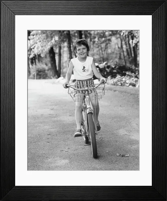 Framed Print : Girl riding a bicycle
