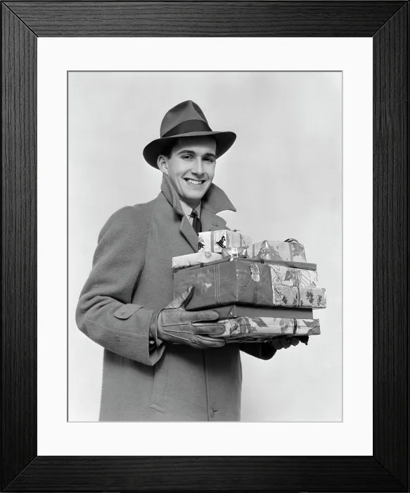 Framed Print : 1930S 1940S Man In Winter Coat Hat And Gloves Holding Pile Of Wrapped Christmas Presents Smiling Framed Print : 1930S 1940S Man In Winter Coat Hat And Gloves Holding Pile Of Wrapped Christmas Presents Smiling