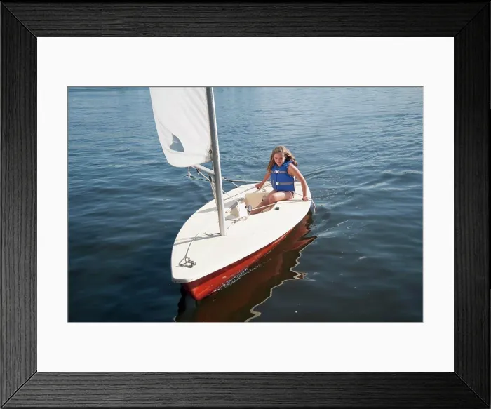 Framed Print : Girl In Small Sailboat Framed Print : Girl In Small Sailboat