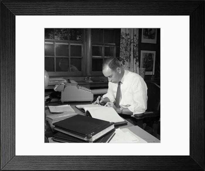 Framed Print : Vintage Photograph. Man seen Checking notes