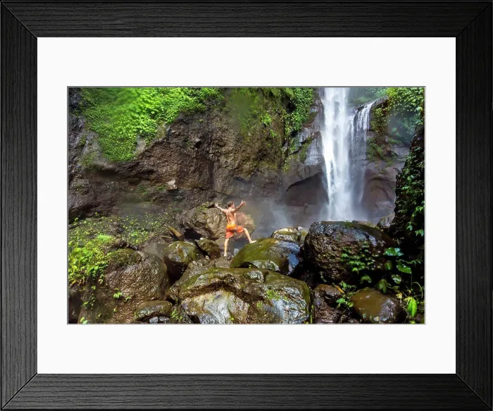 Framed Print : Shirtless man in shorts standing on rocks near waterfall, Kintamani, Bali, Indonesia Framed Print : Shirtless man in shorts standing on rocks near waterfall, Kintamani, Bali, Indonesia