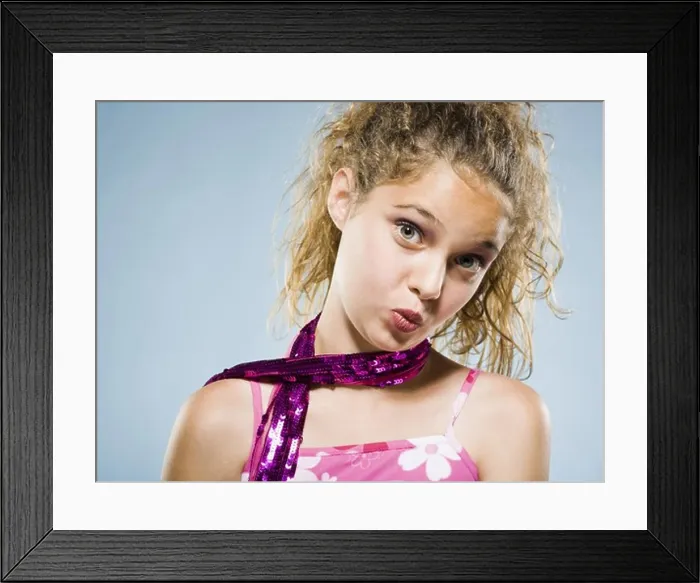 Framed Print : Closeup of girl with lipstick puckering lips Framed Print : Closeup of girl with lipstick puckering lips