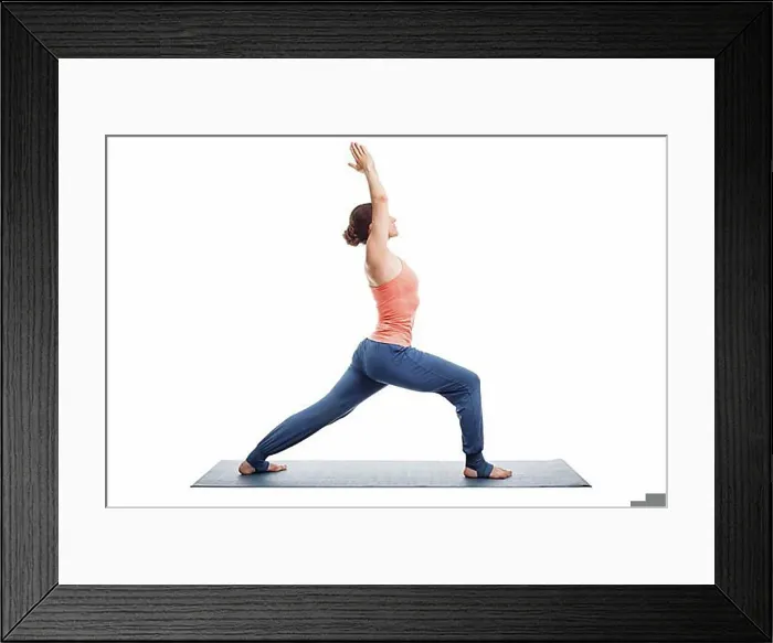 Framed Print : Beautiful sporty fit yogini woman practices yoga asana Virabhadrasana 1, warrior pose 1 isolated on white