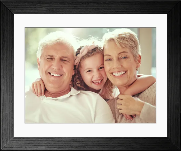 Framed Print : Happy family, children and grandparents hug and bond in living room together Framed Print : Happy family, children and grandparents hug and bond in living room together