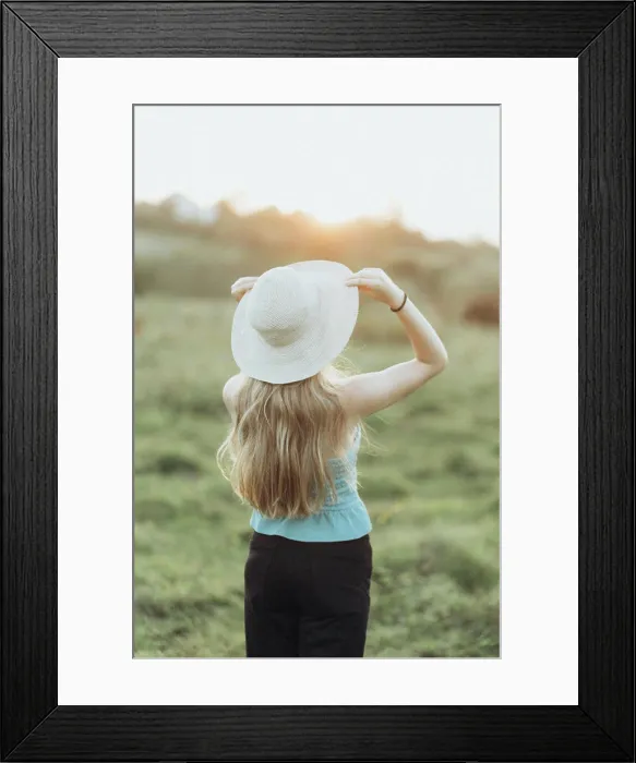 Framed Print : woman in jacket and hat enjoys the sunset alone Framed Print : woman in jacket and hat enjoys the sunset alone