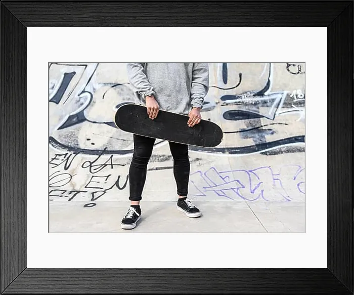 Framed Print : Close up of unrecognizable young man holding longboard or skateboard in the park Framed Print : Close up of unrecognizable young man holding longboard or skateboard in the park