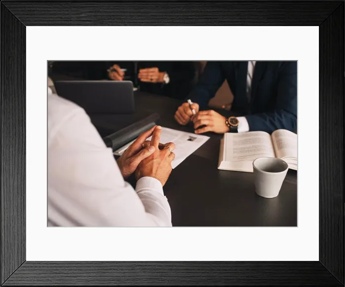 Framed Print : Midsection of lawyer with client in meeting at law office Framed Print : Midsection of lawyer with client in meeting at law office