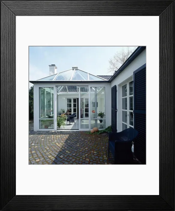 Framed Print : Paving setts in front of conservatory extension on modern white house Framed Print : Paving setts in front of conservatory extension on modern white house