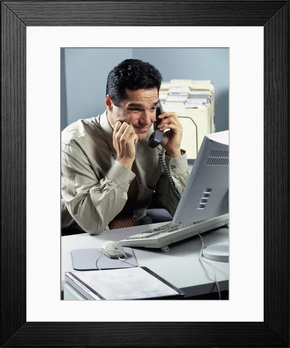 Framed Print : Businessman talking on a landline telephone Framed Print : Businessman talking on a landline telephone