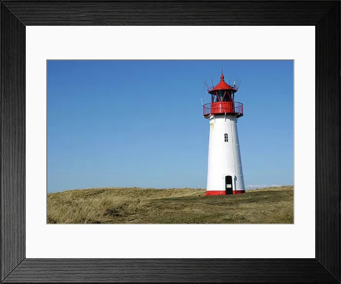 Framed Print : Lighthouse painted red a white standing on grassy hill Framed Print : Lighthouse painted red a white standing on grassy hill