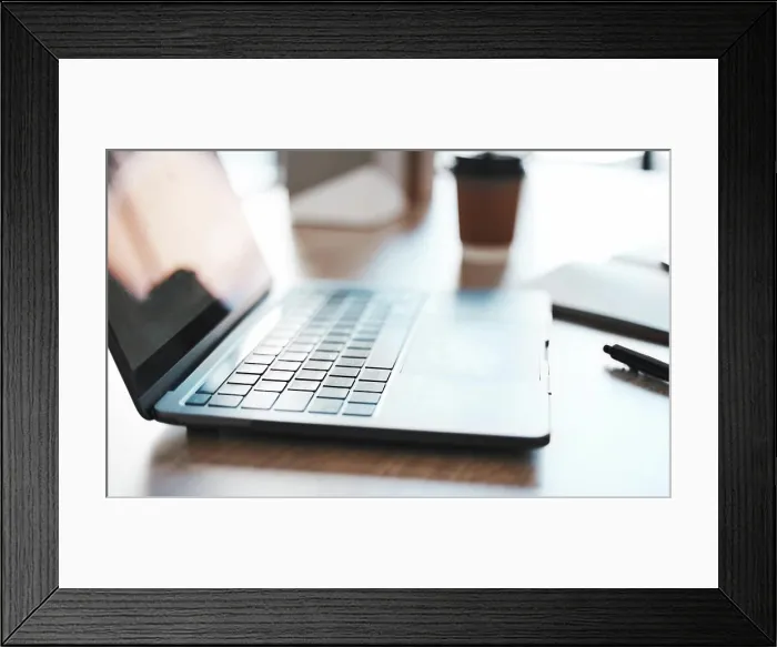 Framed Print : Laptop, computer and desk with a notebook on a table in an empty office at work Framed Print : Laptop, computer and desk with a notebook on a table in an empty office at work