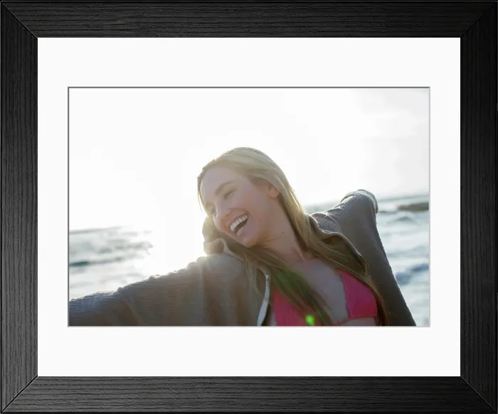Framed Print : Woman enjoying a sunkissed beach scene with joy and freedom Framed Print : Woman enjoying a sunkissed beach scene with joy and freedom