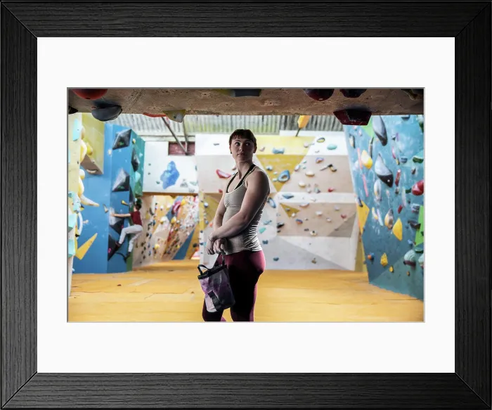 Framed Print : Confident young woman at climbing center Framed Print : Confident young woman at climbing center