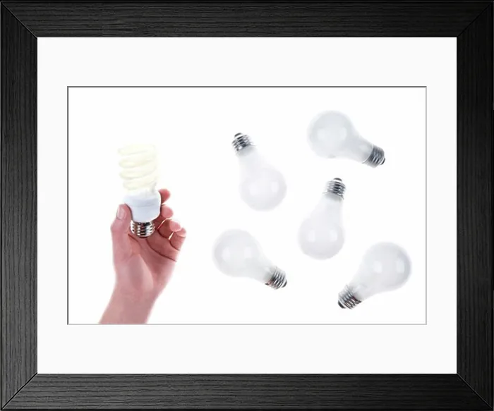 Framed Print : Person Holding Compact Fluorescent Lightbulb near Incandescent Lightbulbs Framed Print : Person Holding Compact Fluorescent Lightbulb near Incandescent Lightbulbs