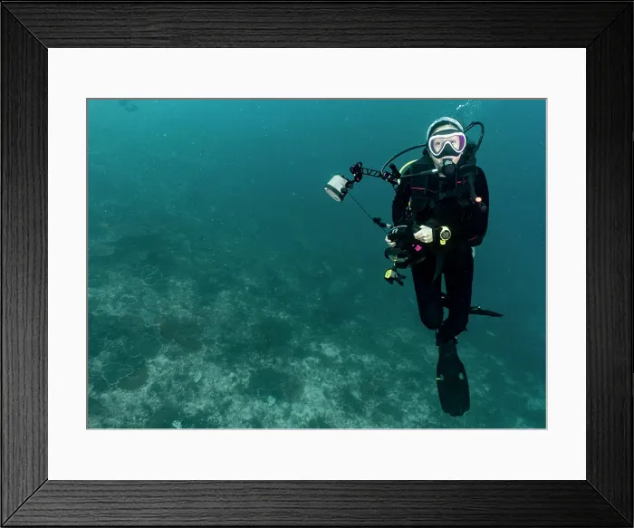 Framed Print : Female diver with underwater camera in Raja Ampat / Indonesia Framed Print : Female diver with underwater camera in Raja Ampat / Indonesia