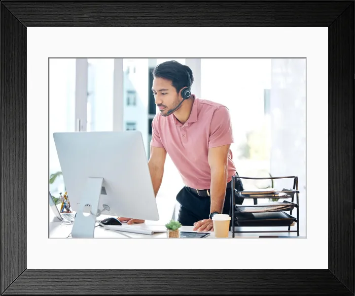 Framed Print : Serious asian man, call center and computer in customer service or desktop support at office desk Framed Print : Serious asian man, call center and computer in customer service or desktop support at office desk