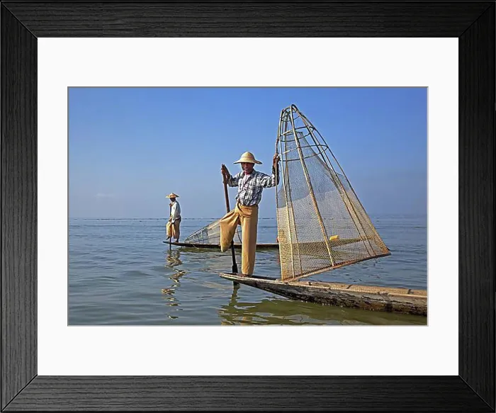 Framed Print : Two Intha fishermen steering traditional fishing boats by wrapping their leg around the oar Framed Print : Two Intha fishermen steering traditional fishing boats by wrapping their leg around the oar