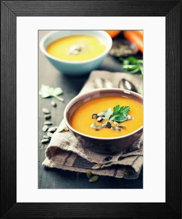 Framed Print : Pumpkin soup in a bowl on a wooden surface Framed Print : Pumpkin soup in a bowl on a wooden surface