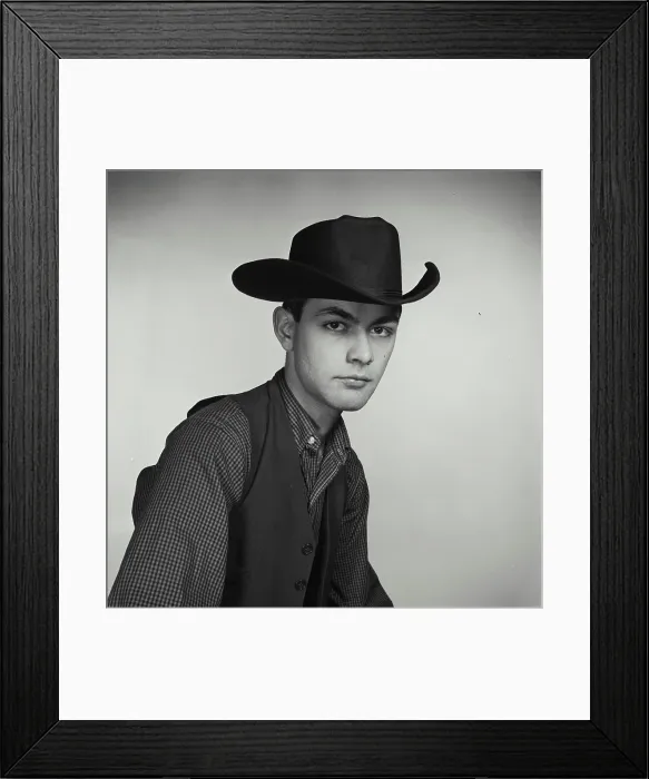 Framed Print : Vintage Photograph. Young man poses for studio portrait wearing cowboy hat and vest Framed Print : Vintage Photograph. Young man poses for studio portrait wearing cowboy hat and vest