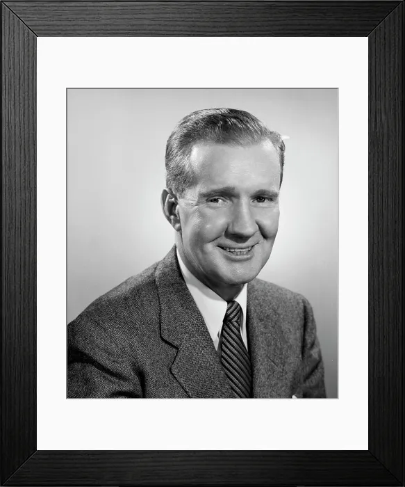 Framed Print : Studio portrait of businessman smiling Framed Print : Studio portrait of businessman smiling