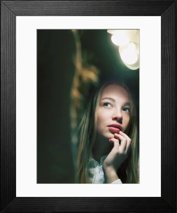 Framed Print : Young woman reflected in mirror looking away Framed Print : Young woman reflected in mirror looking away