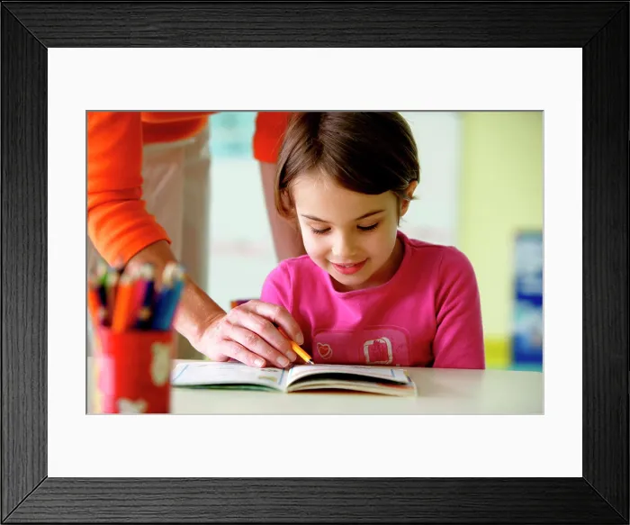 Framed Print : 6 years old girl at school with teacher Framed Print : 6 years old girl at school with teacher