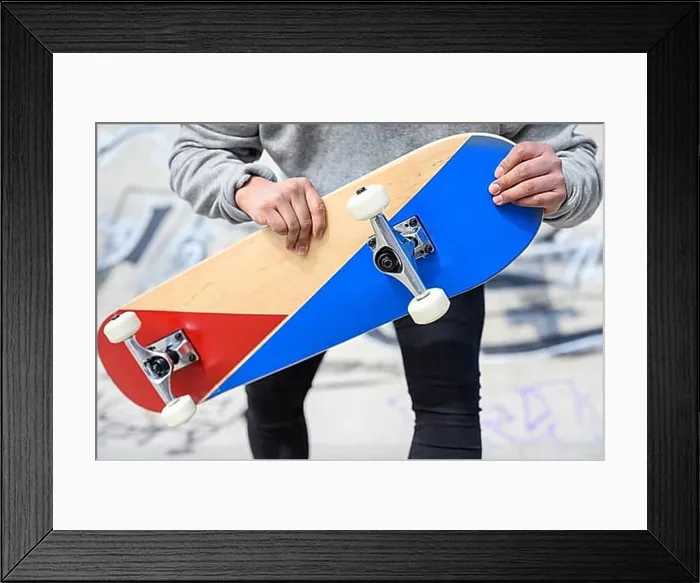 Framed Print : Close up of unrecognizable young man holding longboard or skateboard in the park Framed Print : Close up of unrecognizable young man holding longboard or skateboard in the park