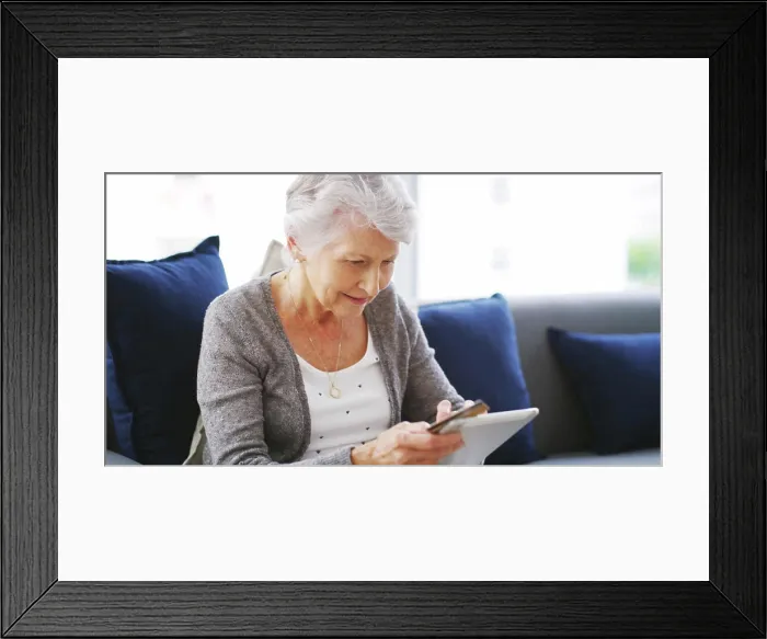 Framed Print : House, tablet and old woman with credit card
