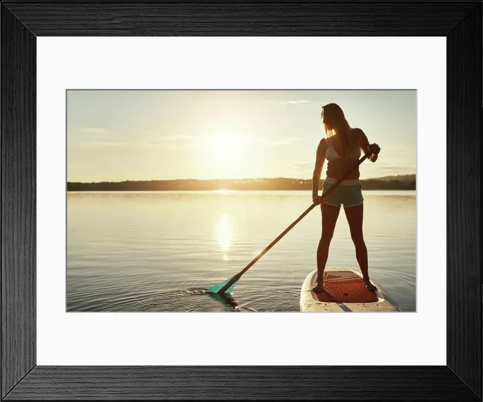 Framed Print : Lake, sunset and woman on paddle board for balance Framed Print : Lake, sunset and woman on paddle board for balance