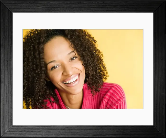 Framed Print : Portrait of a young woman smiling Framed Print : Portrait of a young woman smiling