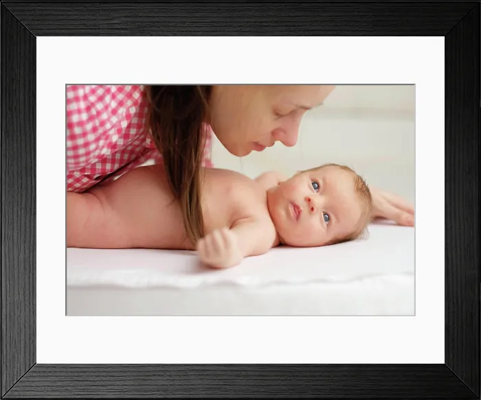 Framed Print : One month old newborn baby with mother One month old newborn baby with his mother Framed Print : One month old newborn baby with mother One month old newborn baby with his mother