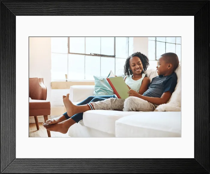 Framed Print : Boy, girl and reading book on sofa house for knowledge Framed Print : Boy, girl and reading book on sofa house for knowledge