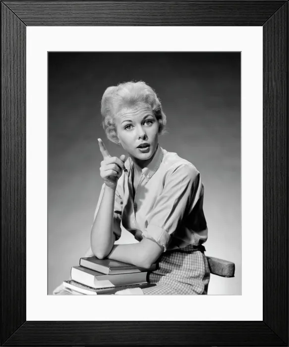 Framed Print : 1950S 1960S Blond Woman Stack Of Books In Her Lap Shaking Finger Pointing Framed Print : 1950S 1960S Blond Woman Stack Of Books In Her Lap Shaking Finger Pointing
