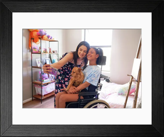 Framed Print : Happy mother and disabled daughter with dog taking selfie at home Framed Print : Happy mother and disabled daughter with dog taking selfie at home