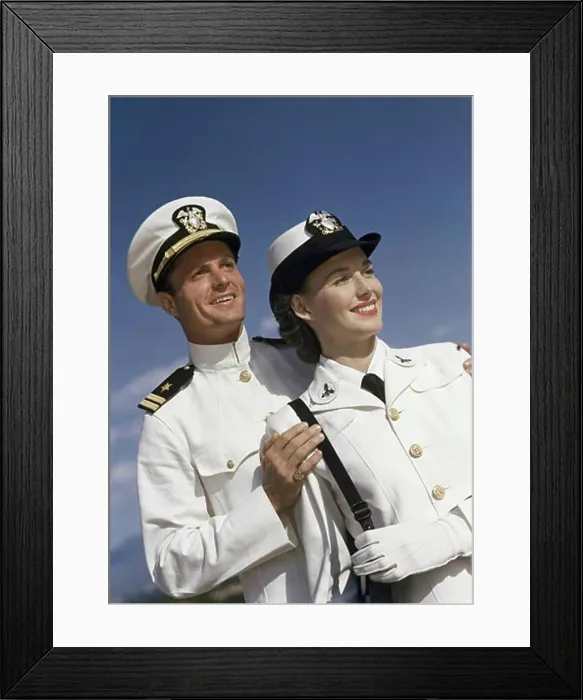 Framed Print : Close-up of a young couple smiling in US Naval uniforms Framed Print : Close-up of a young couple smiling in US Naval uniforms