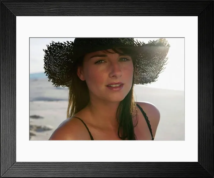 Framed Print : Portrait of a young woman wearing a straw hat Framed Print : Portrait of a young woman wearing a straw hat