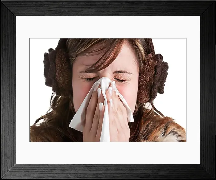 Framed Print : Pale sick woman with a flu, sneezing, in a white background Framed Print : Pale sick woman with a flu, sneezing, in a white background