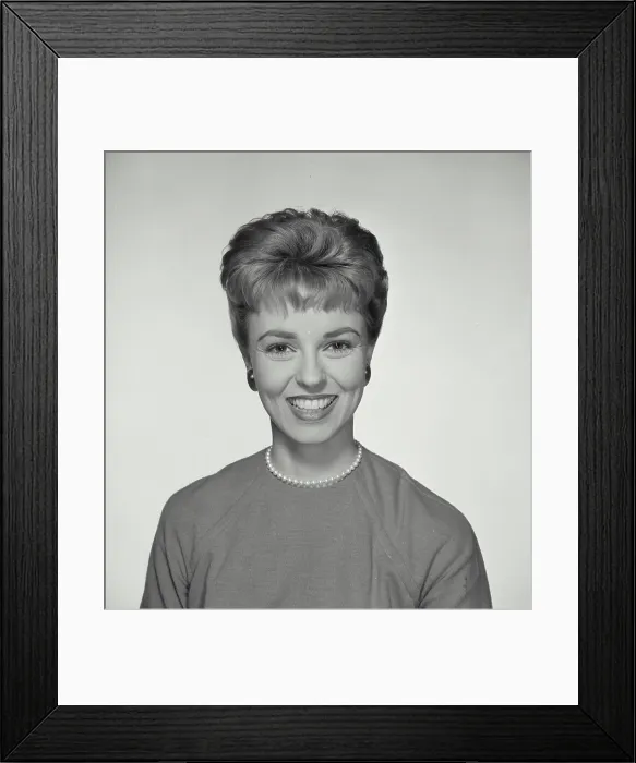 Framed Print : Vintage Photograph. A portrait of a woman with a big smile wearing a pearl necklace with short hairstyle