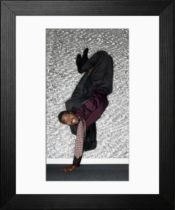 Framed Print : Portrait of African man performing handstand Framed Print : Portrait of African man performing handstand